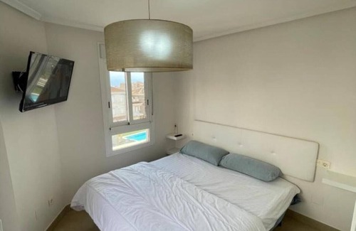 Santa Pola Villa | Villa 'Adosado Santa Pola' with Shared Pool, Wi-Fi and Air Conditioning