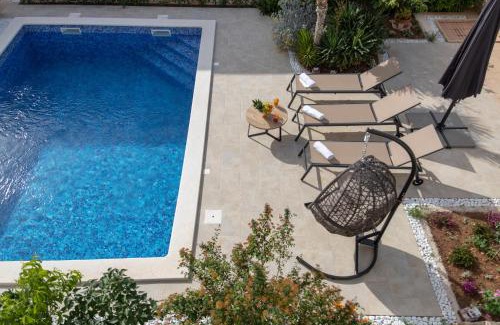 Milna (Brac) Villa | Villa Sun Garden - 4 star villa with heated swimming pool, quiet bay, BBQ, 50m from the sea