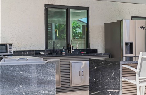 Ludlam Resort | You'll be captivated by the stunning 28 x 40 custom heated pool with jacuzzi