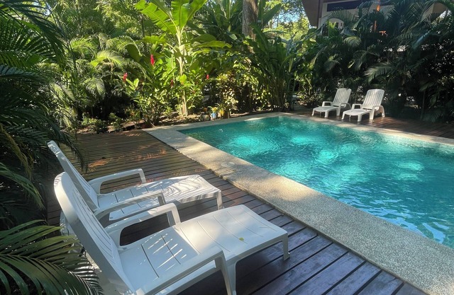 2 1 bedroom cabins with a pool 1 bathroom kitchen, living on a covered deck
