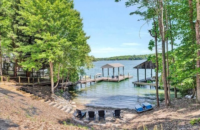 4 Bedrooms, 1 Flex Room, 4 Bathrooms! Beautiful Home with SANDY BEACH! Occupancy 8! HOT TUB! Come