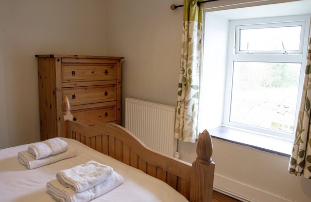 A Semi-detached cottage with open plan living space, located in a fabulous setting.