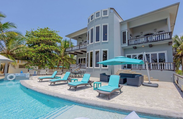 An unBELIZEable home.Barefoot beachfront luxury!