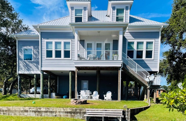 Bayfront home with private pier, boat moorage, patio, & amazing water views
