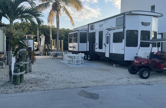 Bayview RV/Camper with private boat dock looking over sunset