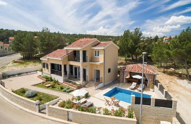 Beachfront villa Noa with heated pool