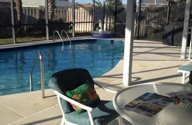 Beautiful home steps to the beach with year round heated pool and spacious lanai