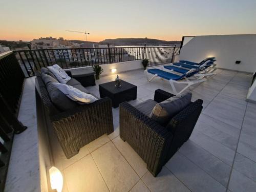 Bright Coastal Penthouse with Huge Terrace Overlooking the Sea- Ghadira Mellieha