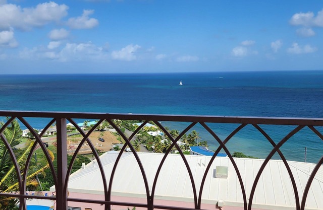 Caribbean Breeze Condo - hilltop breezes, views, convenience to beach & more!