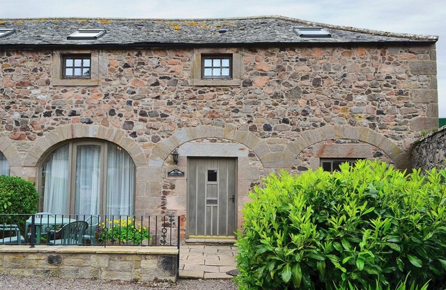 Converted stable block at the foot of the Cheviots between coast and country.