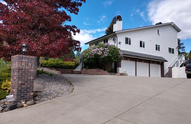 Elegant Hayden Lake view home with a pool