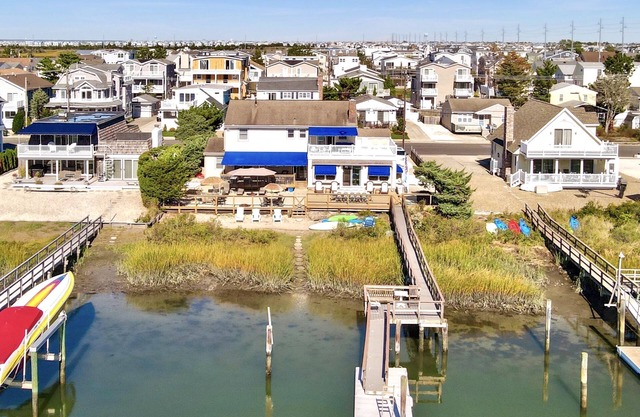 ENJOY BAY VIEWS! Bayfront home, shady front porch 2 boat docking areas, gameroom to watch TV, A short bike ride or walk to Avalon's fine business district for ice cream, dining, mini golf, shopping and more.
