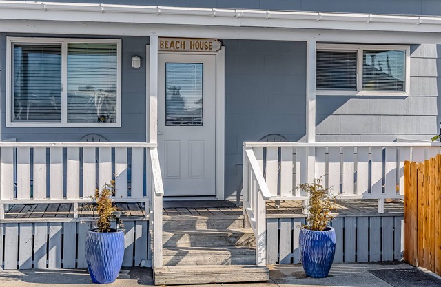 Enjoy views of the beach, the bay, & the canal from this dog-friendly home!