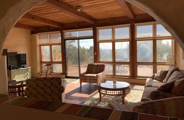 Escape a cold winter in our large passive solar adobe home with 4 gentle seasons