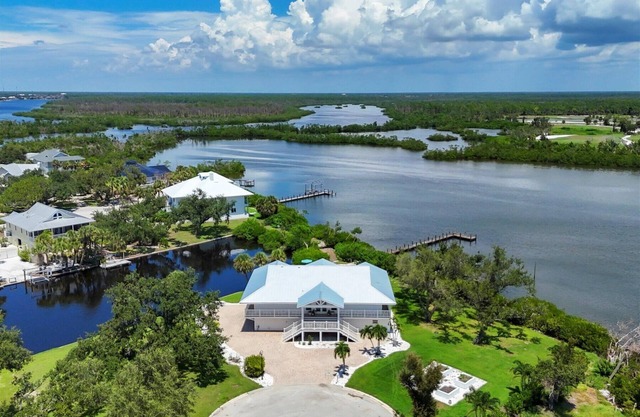 Experience luxury at The Lookout, a 3-bedroom home in scenic Placida, FL with ocean views.