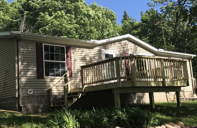 Family home at end of road on small, quiet lake.