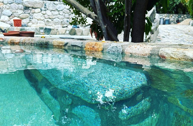 Glamping orchard and suites with large stone kitchen and pool in Baja Sur.
