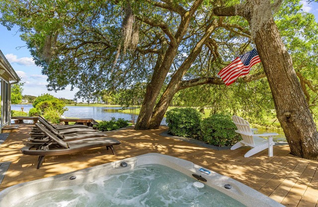 Gorgeous waterfront home with private hot tub, pool, views, deck, & fireplace