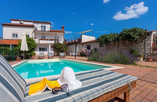 Holiday home with pool and air conditioning