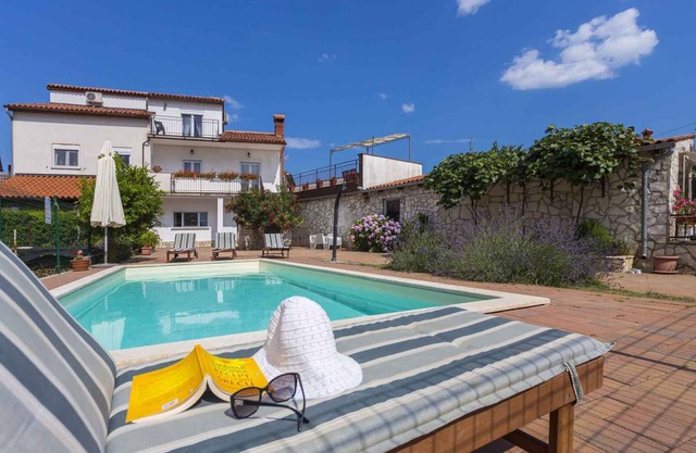 Holiday home with pool and air conditioning