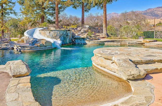 Mansion on 10-acre ranch with private resort-style pool, gym, & theater