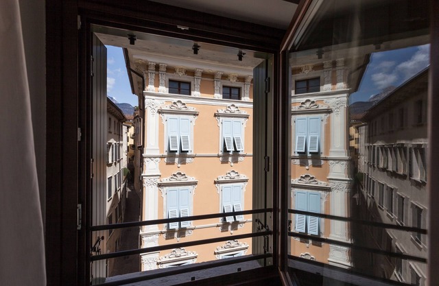 Modern, Centrally Located Apartment "RivApartmentsDowntowN - Love" with a View of the Old Town of Riva del Garda, A/C & Wi-Fi