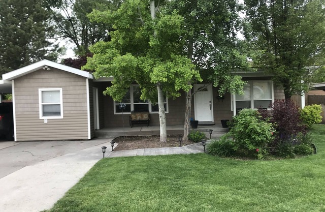 Open floor plan with a covered patio and fenced yard.