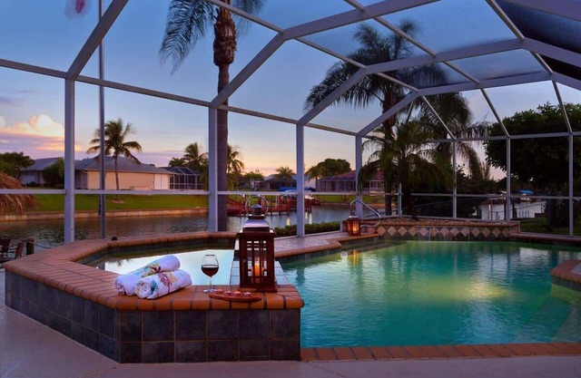 Pretty Waterfront Home w/Heated Pool/Spa + Tiki