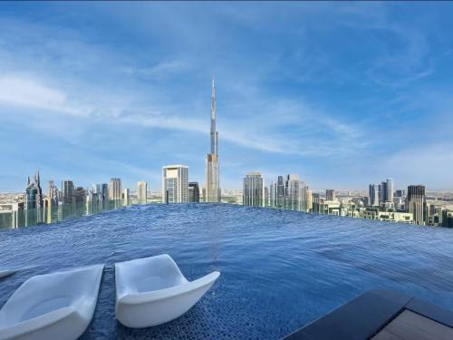 Restay Homes at Paramount Midtown Hotel - Highest infinity pool access with Burj View