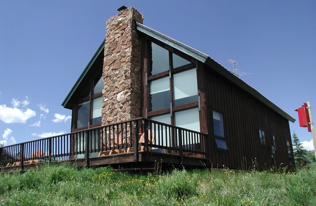 Rustic mountain home with stunning mountain views from the large deck!