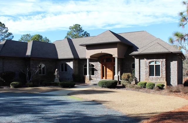 Secluded 22 ac with 6,500 sq ft home 4 BR/ 5 BA pool, deck 2 ½ ac pond, kid area