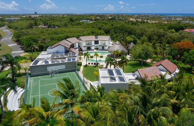 Soaring Circular Home in Paradise with Multiple-Sports Court, Gym & Home Theater
