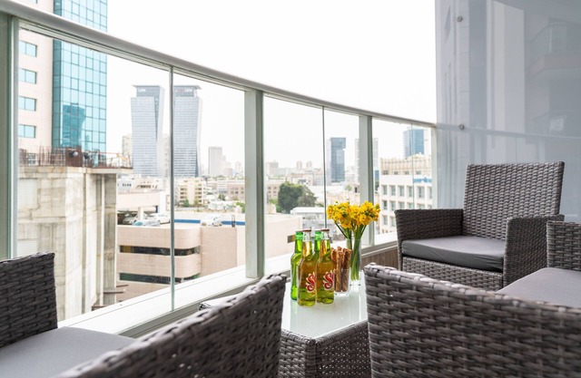 Sunlit Urban Escape with Balcony by Sea N Rent