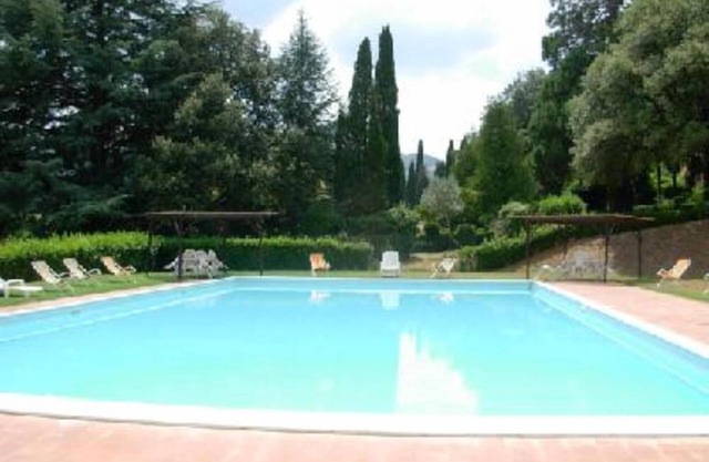 Typical Tuscan Villa between wineyards and olive trees