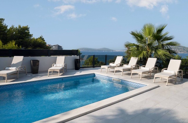 Villa Palm Bay 1, heated pool - 5 m from the sea, private parking, with stunning sea view, nice terrace, beach access.