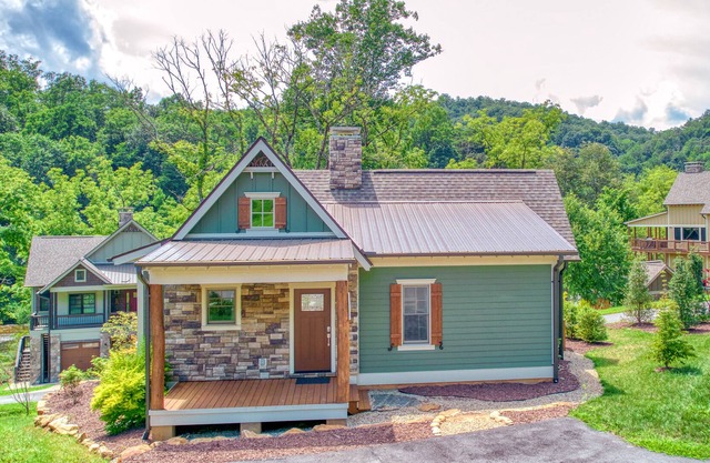 Water-view home along the river with central AC, gas fireplace & screened porch