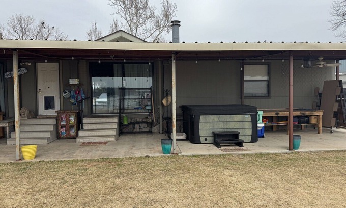 Graford House | 3B/3B Lake front property with dock, hot tub, and entertainment area outside!
