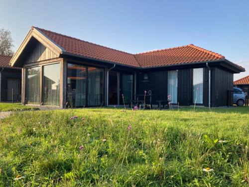Anjum House | 4-person chalet Albatros by the water with parking space