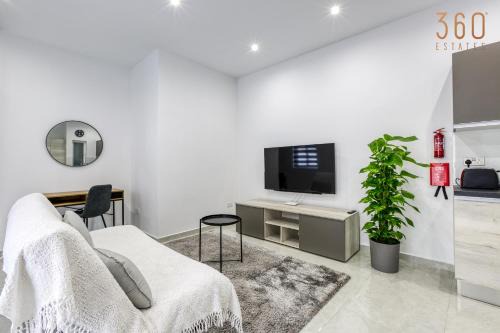 Il-Balluta Apartment | A lovely 1BR home with Balcony just off the coast by 360 Estates