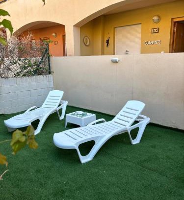Vera Beach Apartment | Bajo con jardín a pie de playa y piscina comunitaria con jacuzzi