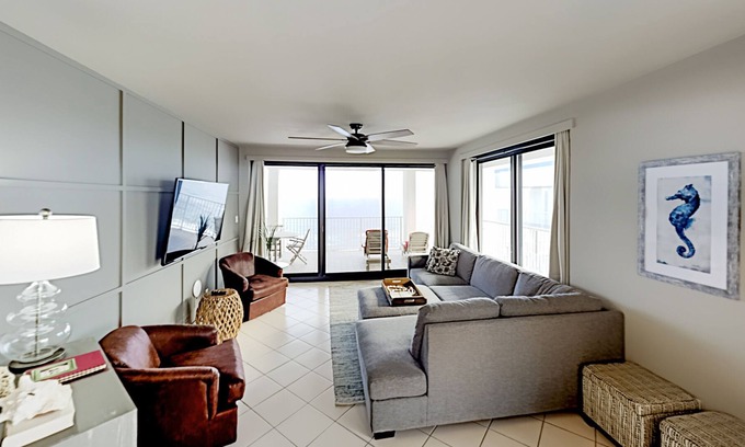 Orange Beach Condo | Beachfront corner condo with pools, a hot tub, tennis, & sauna