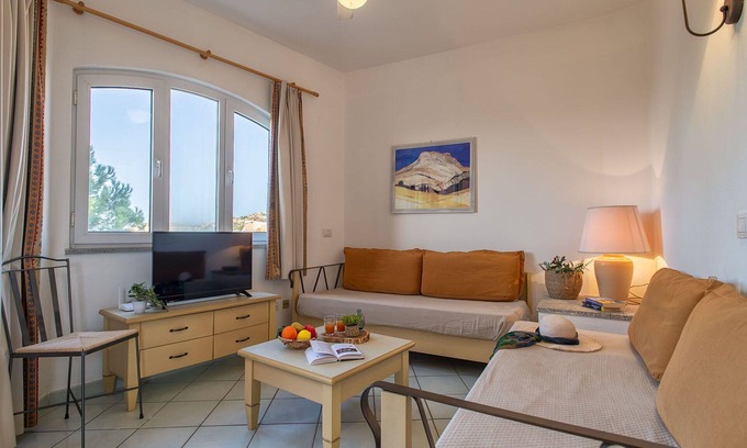 Canneddi Apartment | Beautiful apartment for 4 guests with WIFI, pool, A/C, TV, terrace and pets allowed