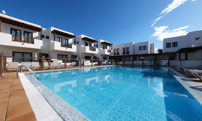 Puerto Calero Ski Chalet | Bella Vista - Shared Pool and BBQ By Lanzarote Vacation Homes