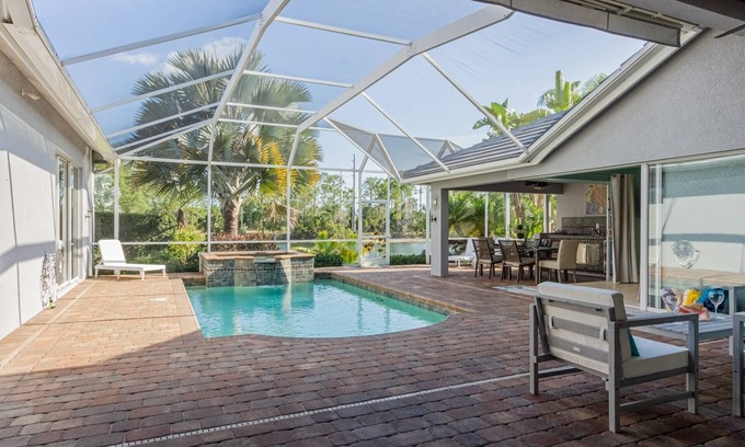 Central Naples House | Briarwood home w/heated pool/spa-outdoor kitchen-retractable awning-private lake view