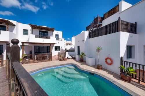 Punta Mujeres House | Casa Hibiscus - Shared Pool and BBQ - Close to Seafront Promenade By Lanzarote Vacation Homes