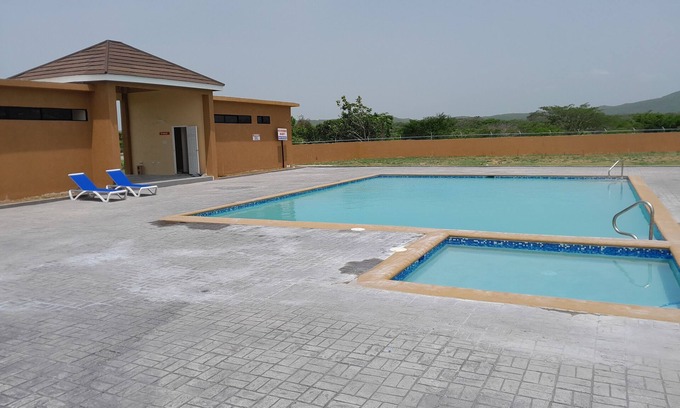 Old Harbour House | Charming 2-bedroom house in Old Harbour with AC, fitness room. C & J"s Vacation
