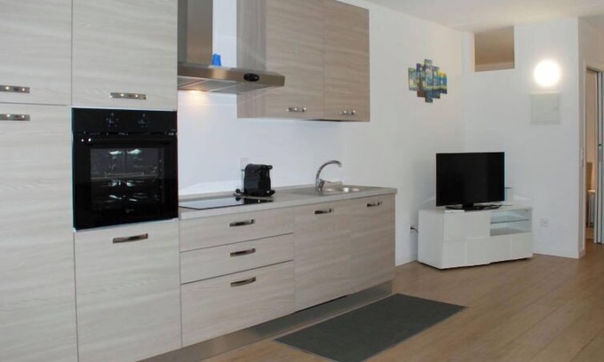 Bissone Apartment | Charming Gardenview App. 102 by Interhome