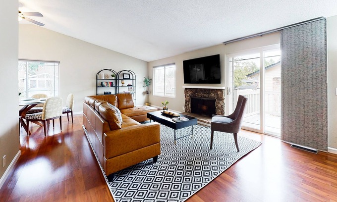 Bothell House | Charming retreat with a wood-burning fireplace, balcony, and a foosball table