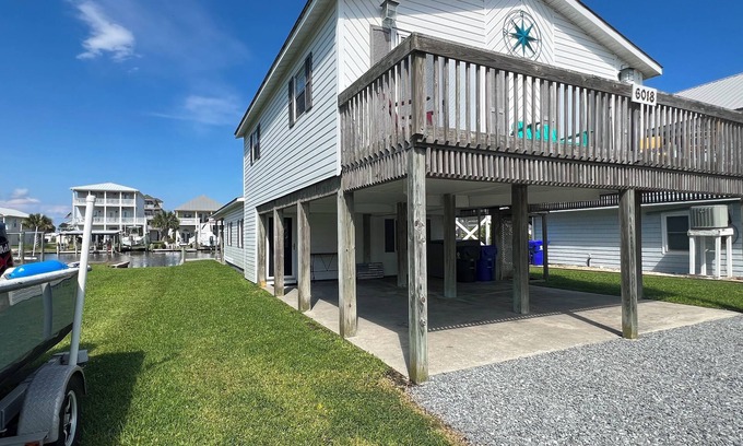 Surf City Cottage | Deep-Water Canal Front Coastal Cottage Only Steps to the Beach & Pet Friendly!