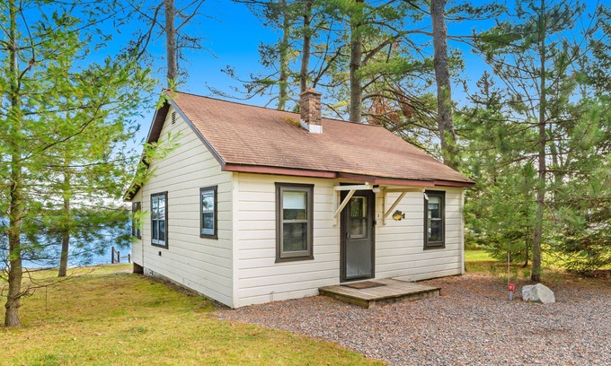 Presque Isle Cabin | Dog-friendly lakefront resort with swimming, fishing, boating, & rec room
